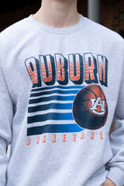 Auburn University Auburn Basketball Vintage White Gildan Sweatshirt with retro style Orange text "Auburn" and an image of a basketball with the AU Logo