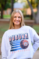 Auburn University Auburn Basketball Vintage White Gildan Sweatshirt with retro style Orange text "Auburn" and an image of a basketball with the AU Logo