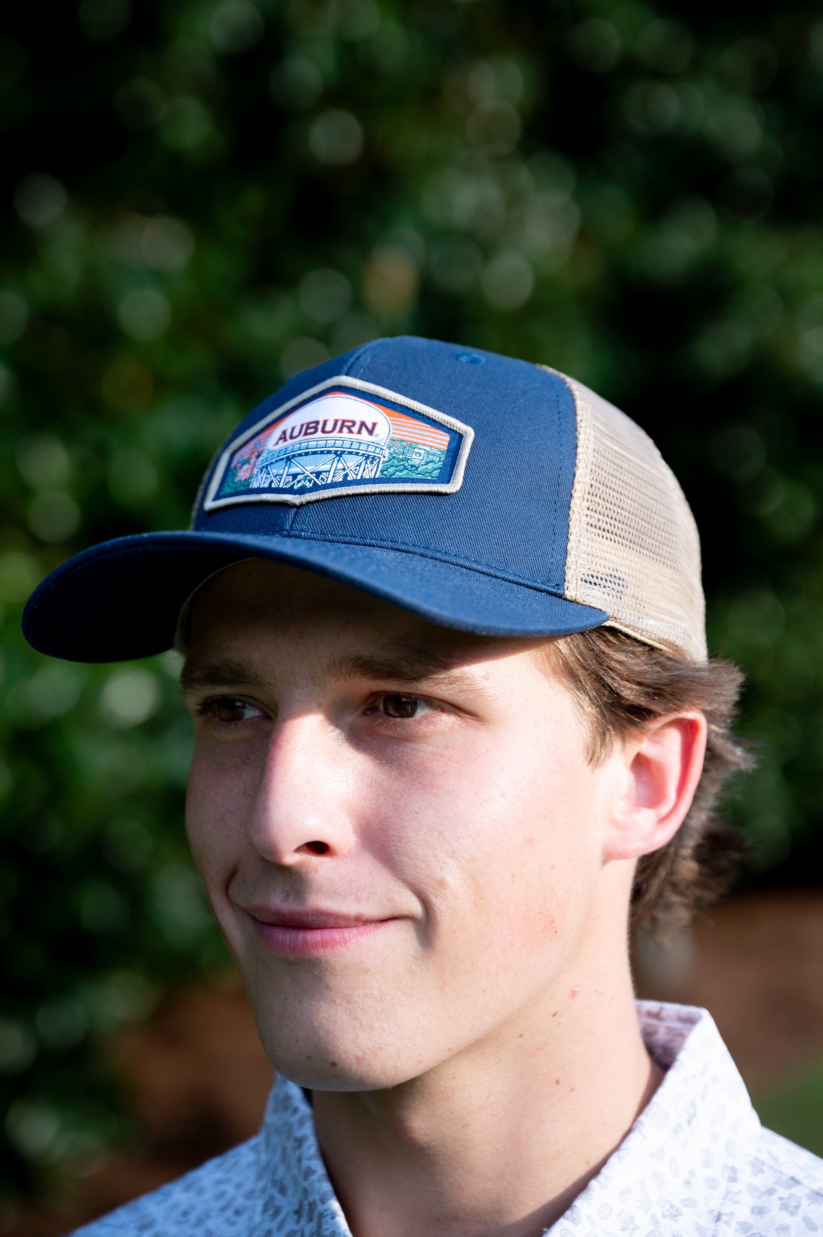 Auburn University Navy Trucker Hat with a woven patch depicting the Auburn University campus.
