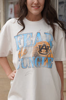 Auburn University Off-White T-Shirt with 'FEAR THE JUNGLE' text, a basketball with the AU Logo and tiger claw marks design
