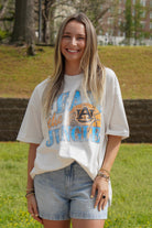 Auburn University Off-White T-Shirt with 'FEAR THE JUNGLE' text, a basketball with the AU Logo and tiger claw marks design