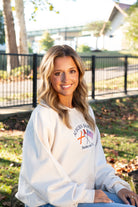 Auburn University Cream Sweatshirt with Navy text “Auburn Family” above the state flag and American flag crossed under the Block Auburn A 