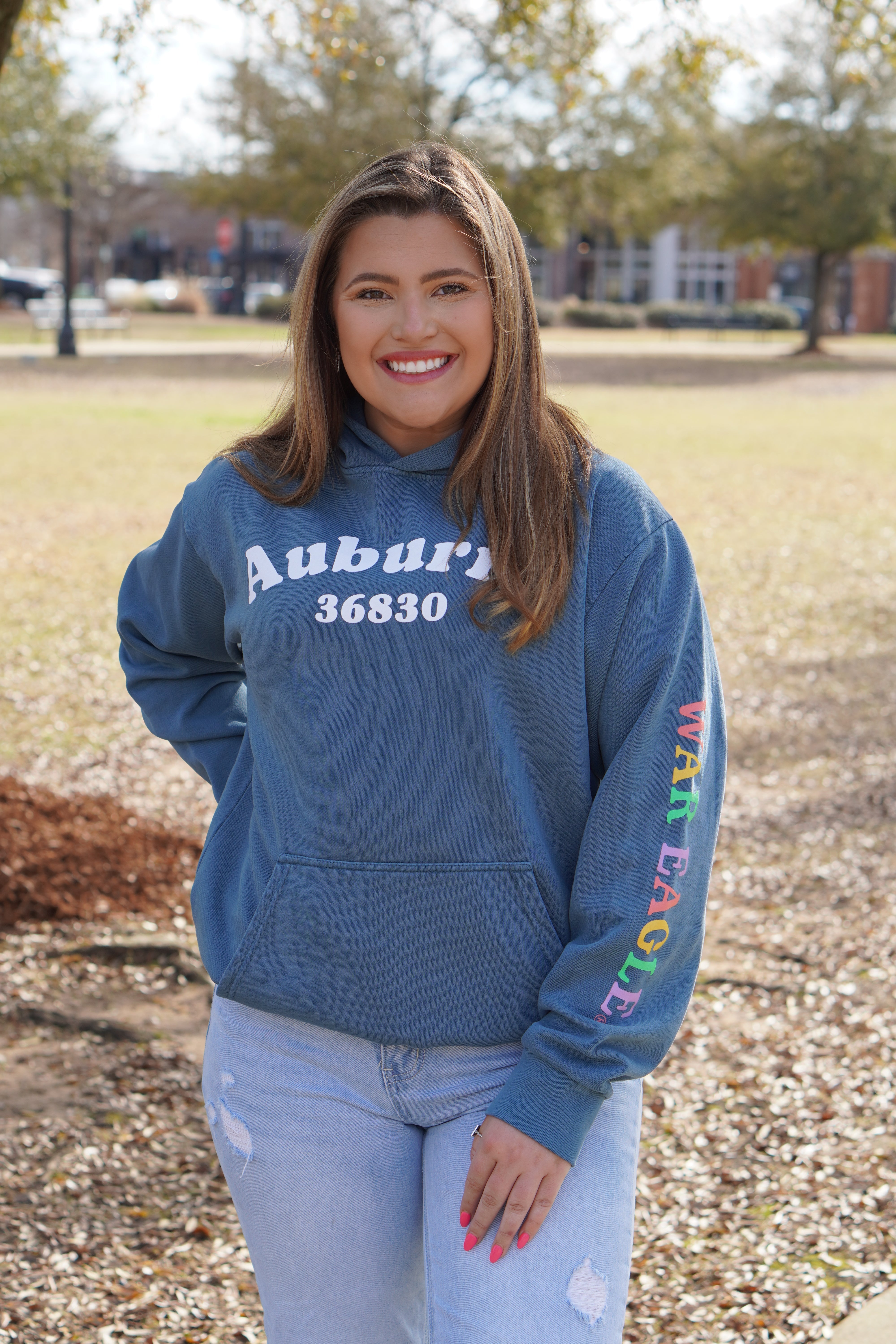 Auburn University Auburn Happy Blue Lane Seven Ladies Hoodie with White text "Auburn" above the Auburn zip code "36830" (Front)| colorful "War Eagle" (Sleeve)