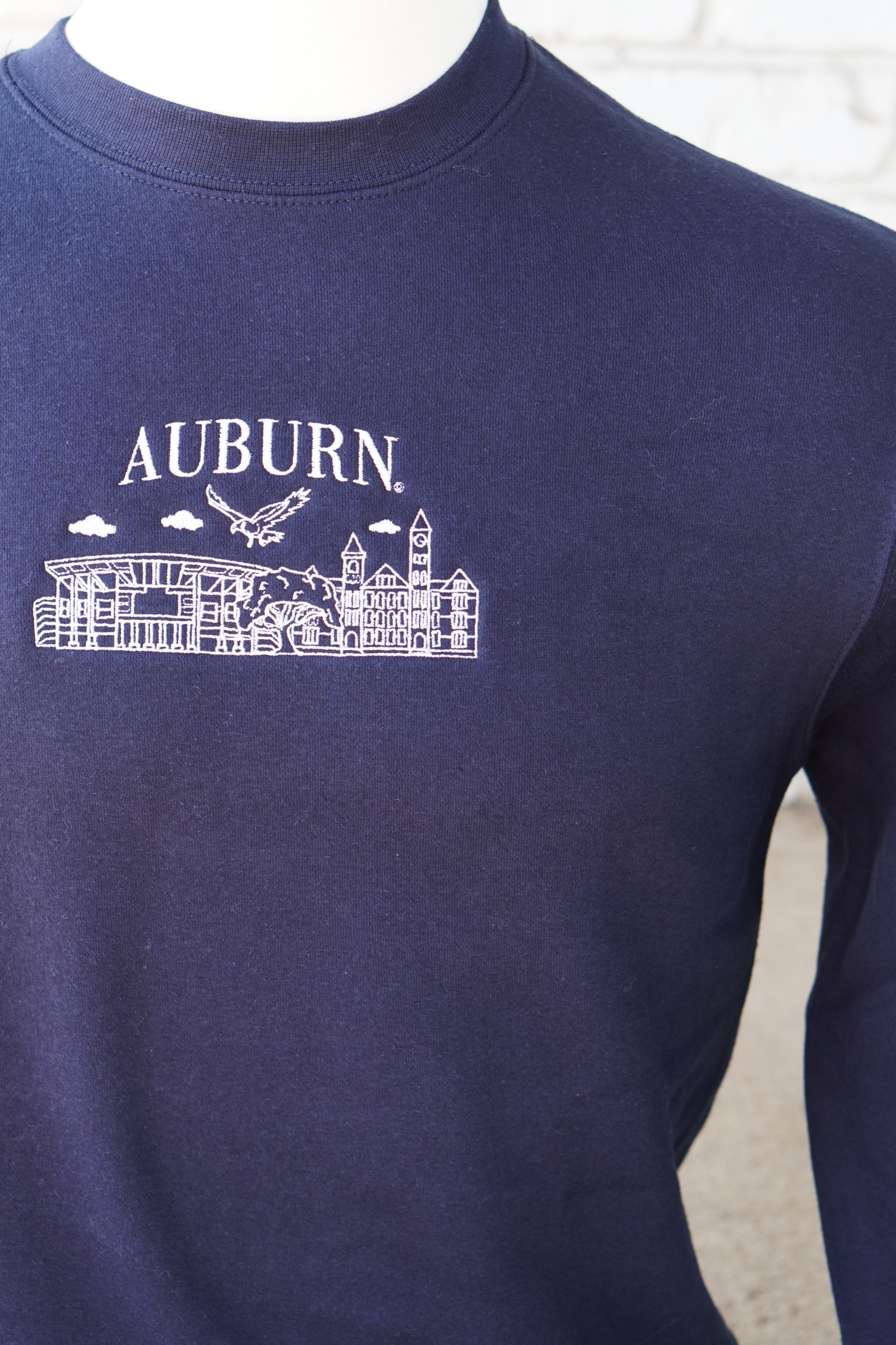 Auburn University Auburn Landmarks Navy Lane Seven Ladies' Sweatshirt with White embroidery of Auburn landmarks under text "Auburn"