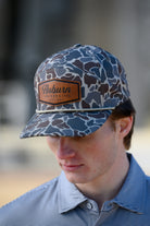 Auburn University Auburn Leather Patch Hat Duck Camo JNJ 7-Panel Hat with White rope and Leather patch with text "Auburn University"