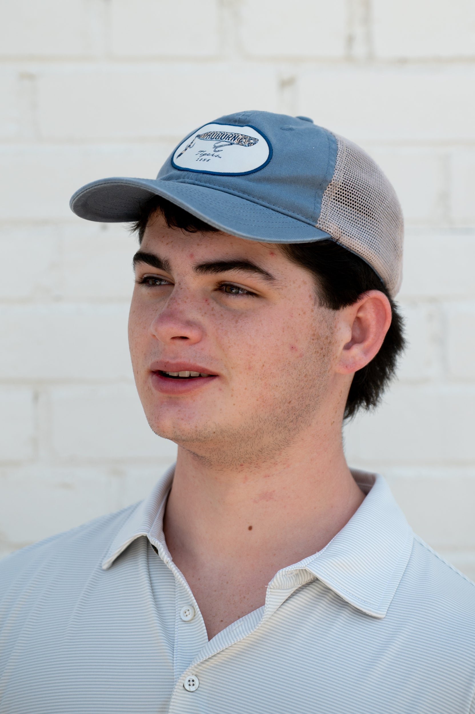 Auburn University Dusty Navy Hat featuring a patch with a tiger fishing lure with the Blue text “Auburn”