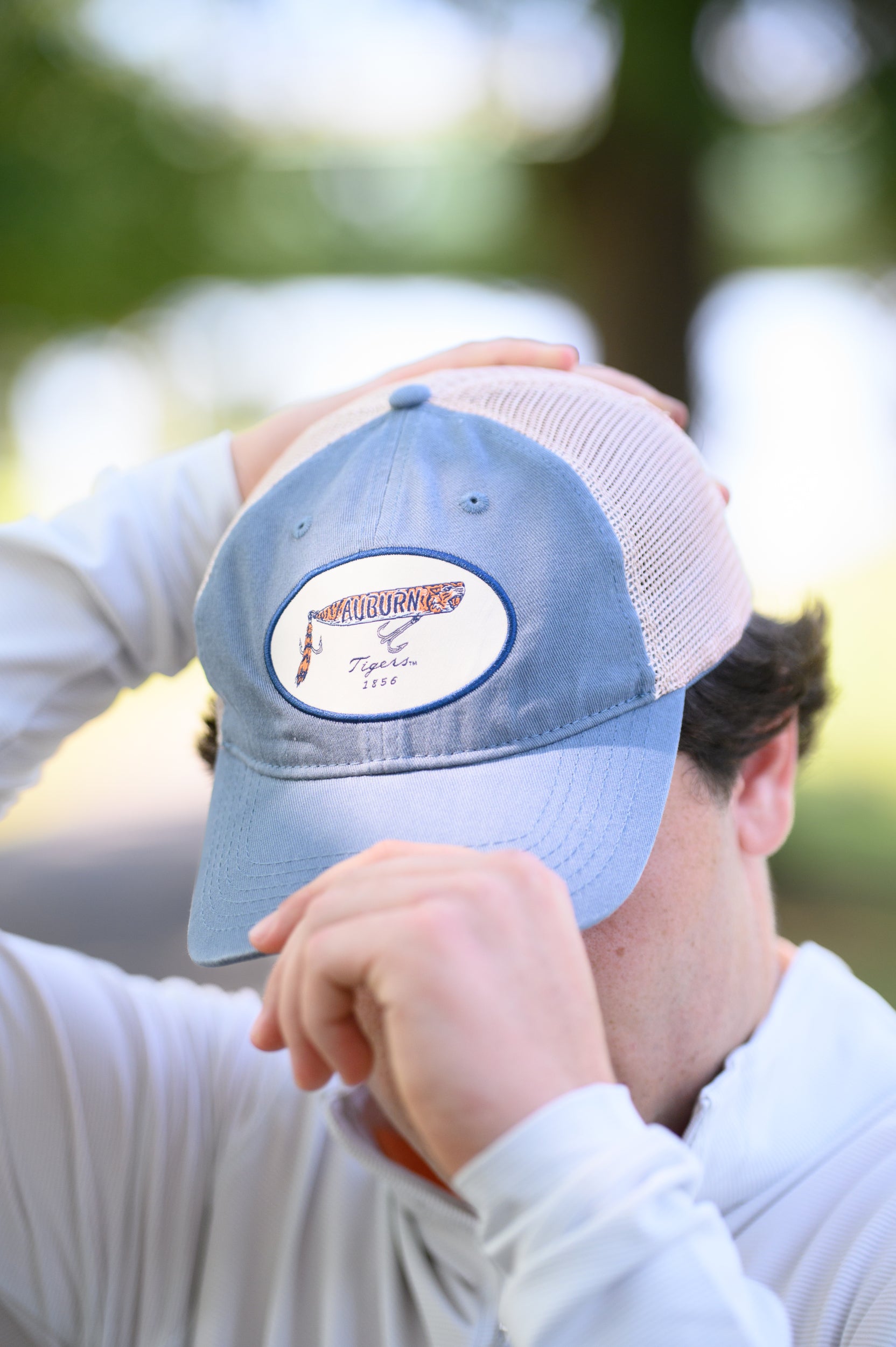 Auburn University Dusty Navy Hat featuring a patch with a tiger fishing lure with the Blue text “Auburn”