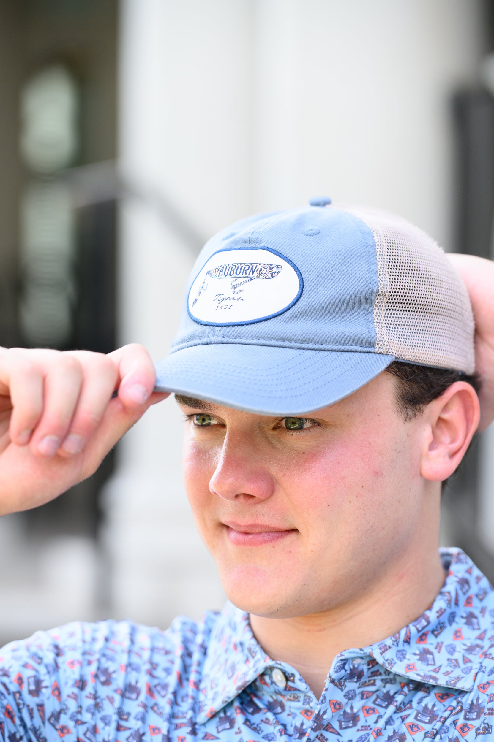 Auburn University Dusty Navy Hat featuring a patch with a tiger fishing lure with the Blue text “Auburn”