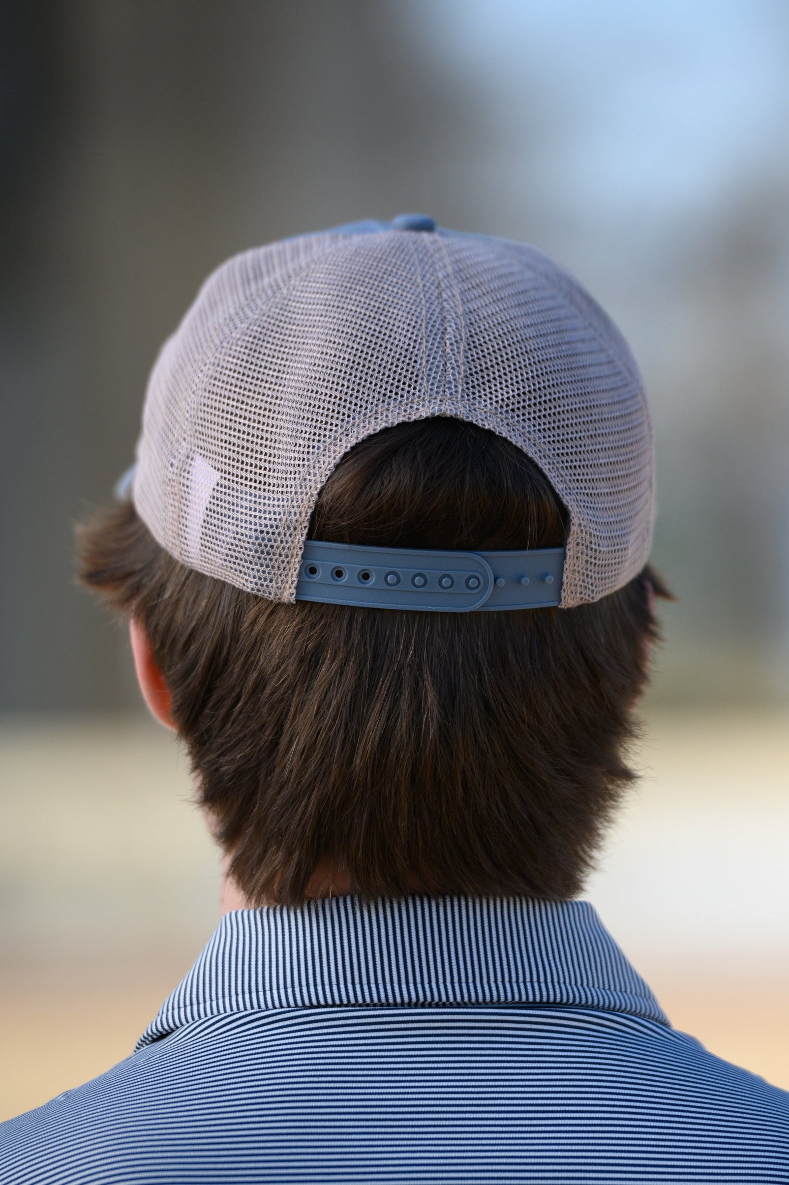 Auburn University Dusty Navy Hat featuring a patch with a tiger fishing lure with the Blue text “Auburn."
Snapback Trucker