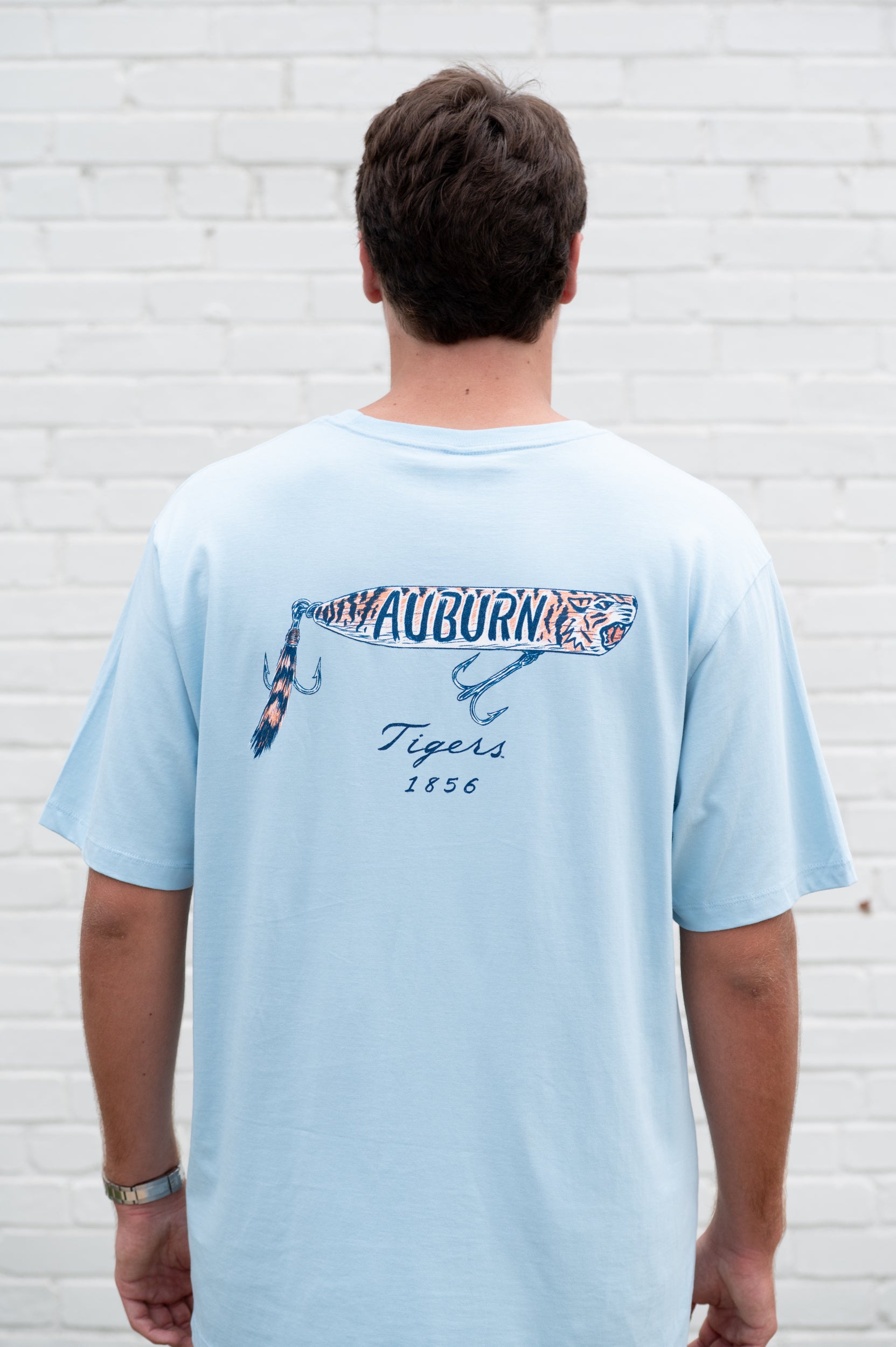 Auburn University Light Blue T-Shirt with a tiger fishing lure with the Blue text “Auburn”