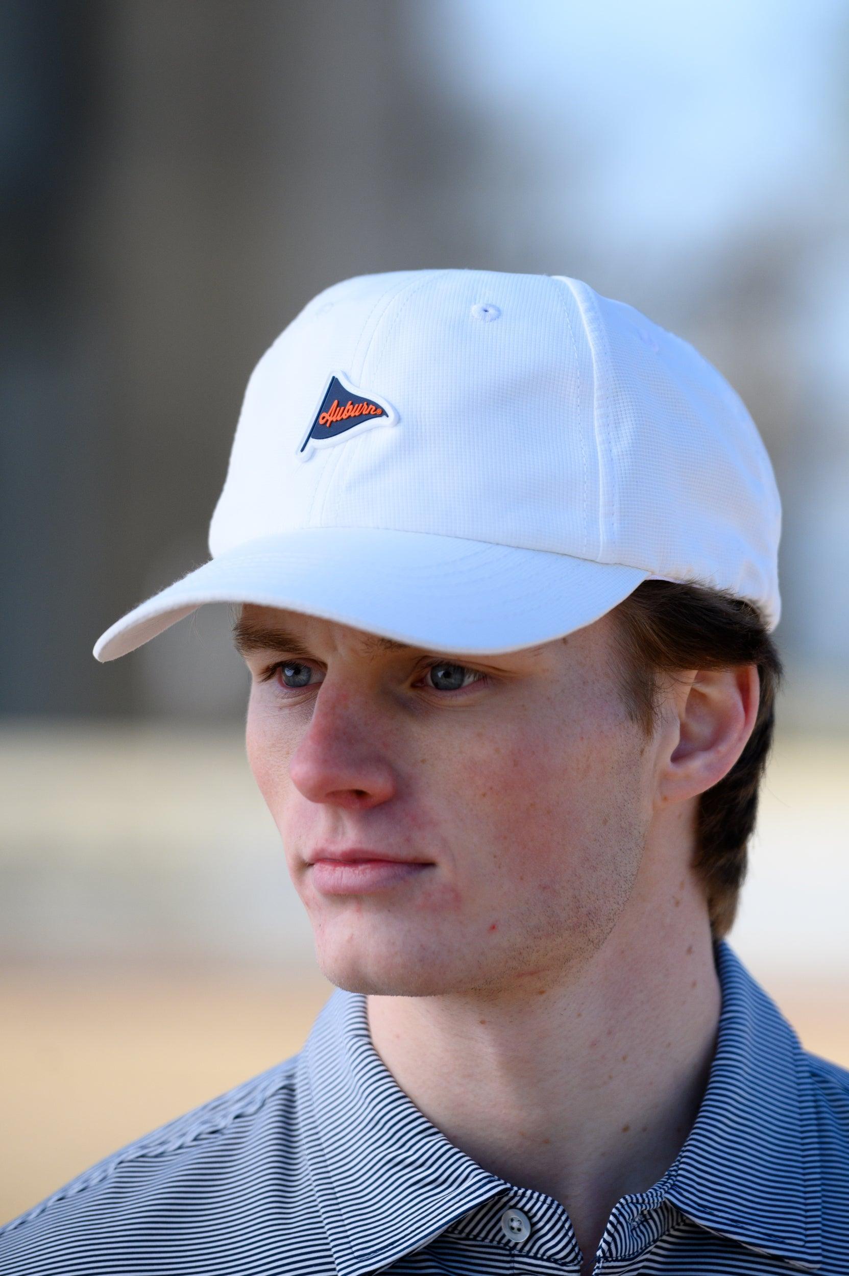 Auburn University White Hat featuring a Navy pennant flag patch with Orange script “Auburn”