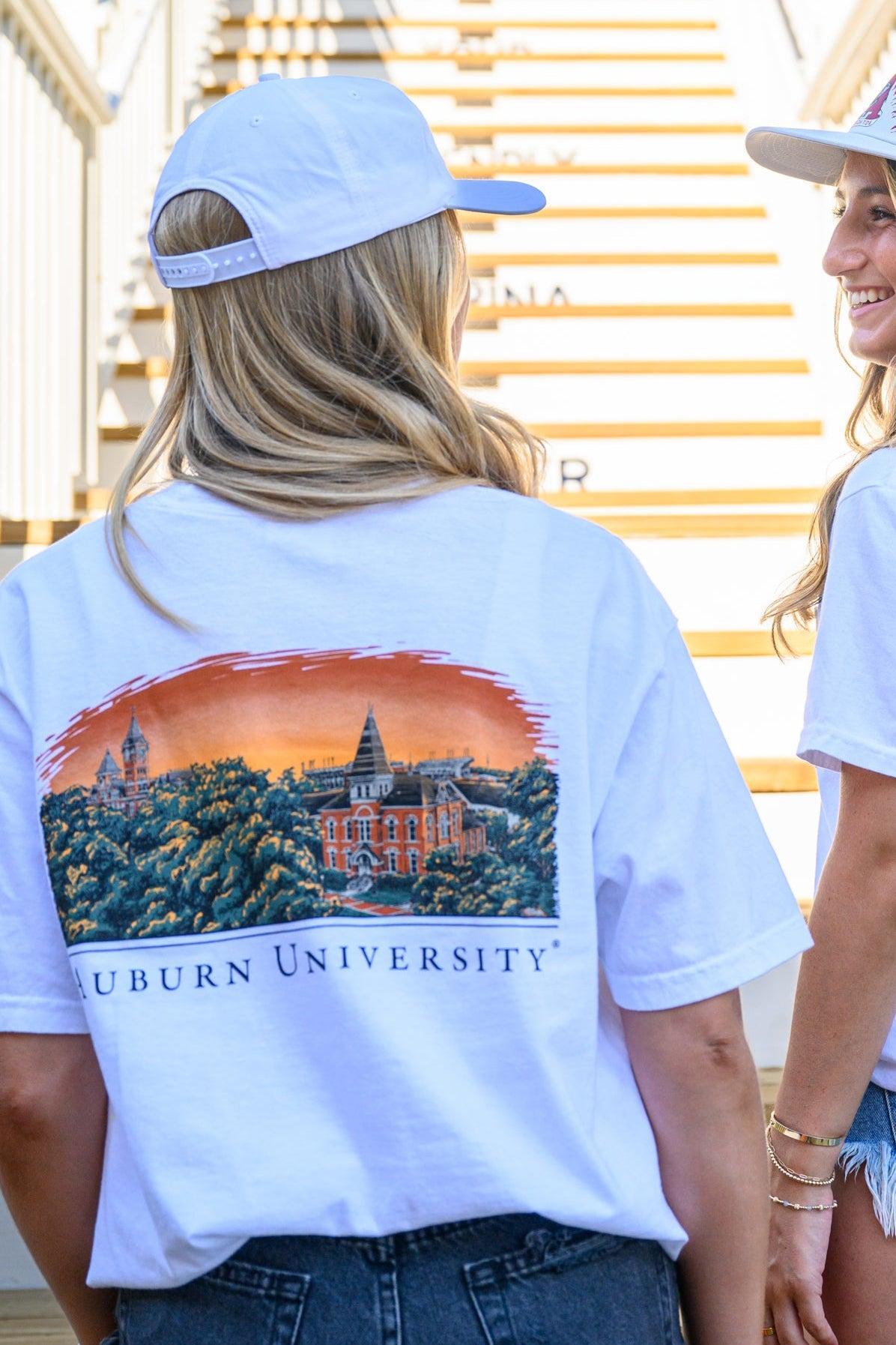 Auburn University Auburn Skyline White Comfort Colors T-Shirt with an image of a sun setting on the University above text "Auburn University"