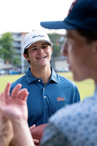 Auburn University Auburn Tigers Navy Hex Polo Men's Navy JNJ Performance polo with a subtle hex pattern and an embroidered Auburn Tigers script logo on the left chest. 
