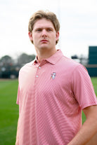 University of Alabama Men's Crimson Stripe Performance Polo with an embroidered image of Big Al in a baseball uniform leaning on a baseball bat