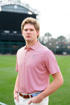 University of Alabama Men's Crimson Stripe Performance Polo with an embroidered image of Big Al in a baseball uniform leaning on a baseball bat