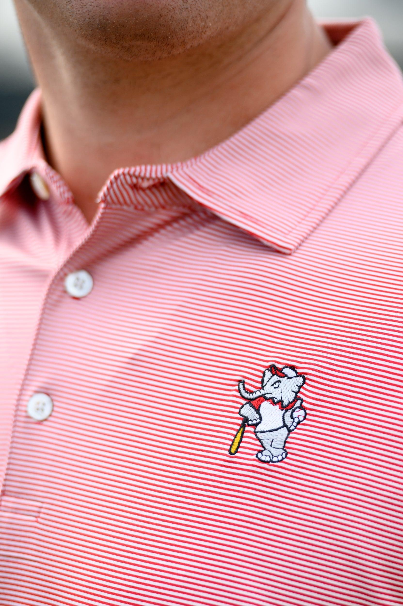 University of Alabama Men's Crimson Stripe Performance Polo with an embroidered image of Big Al in a baseball uniform leaning on a baseball bat