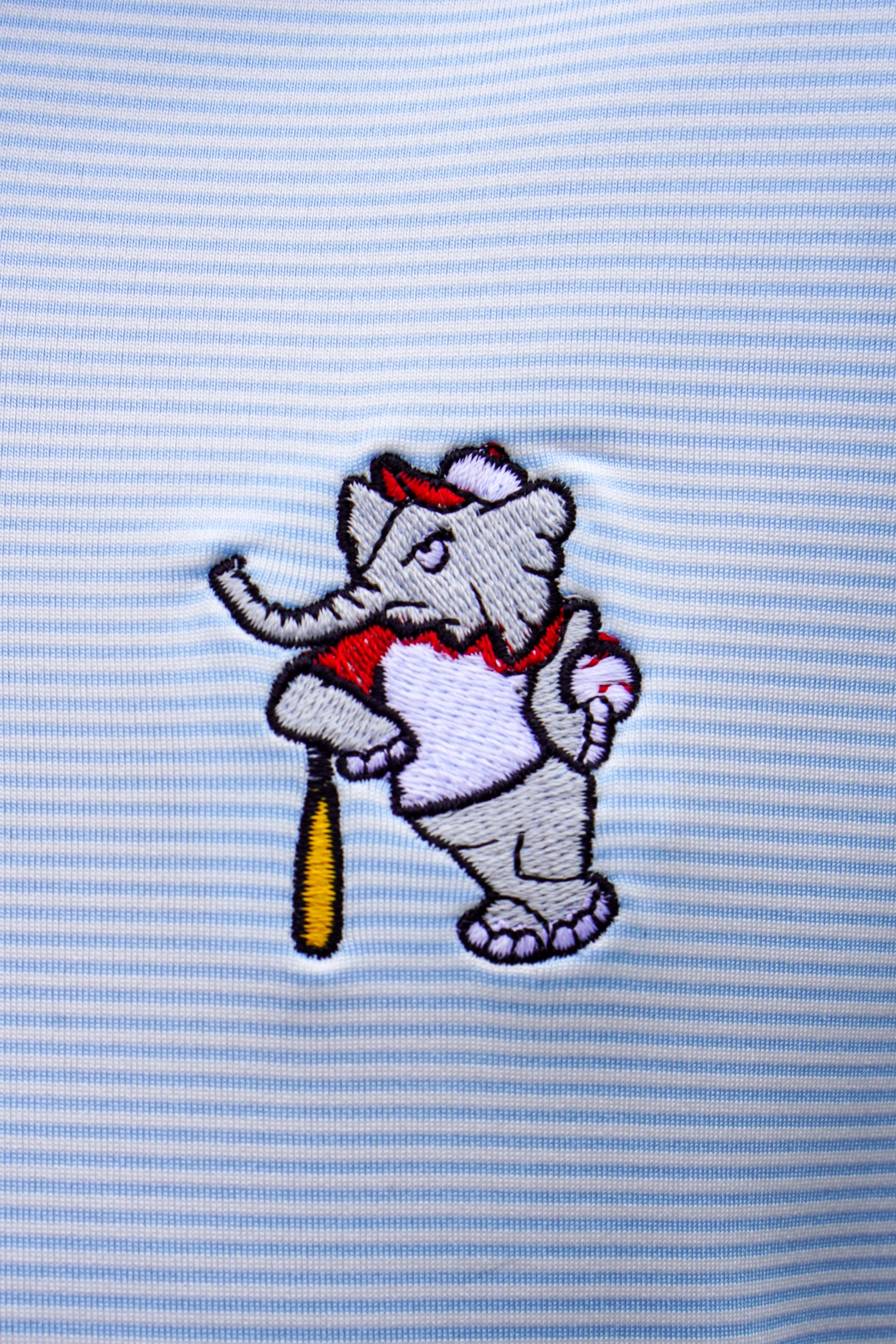 University of Alabama BallPlayer Al Men's Light Blue Performance Polo with an embroidered image of Big Al in a baseball uniform leaning on a baseball bat