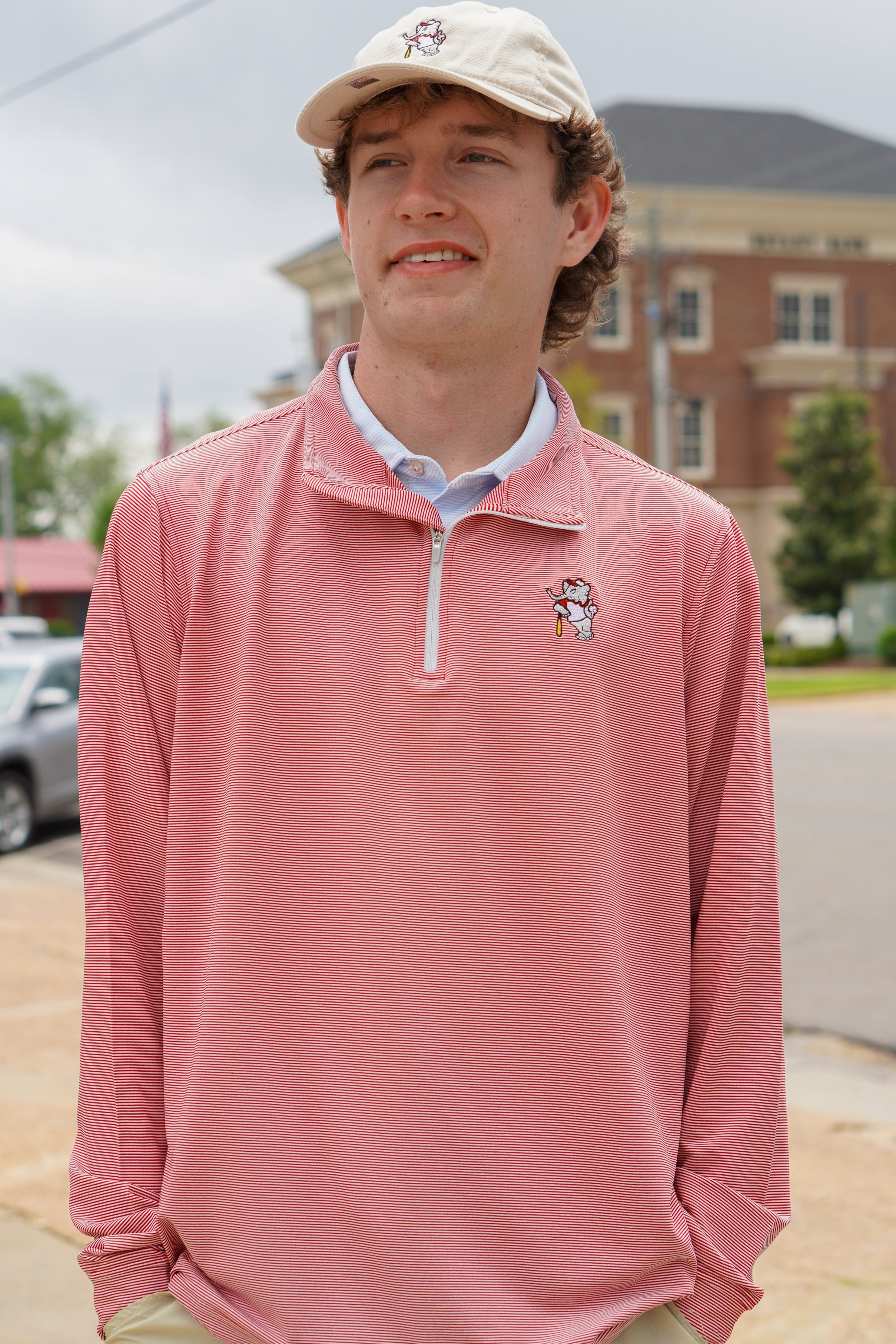 University of Alabama BallPlayer Al Men's Crimson Performance Pullover with an embroidered image of Big Al in a baseball uniform leaning on a baseball bat
