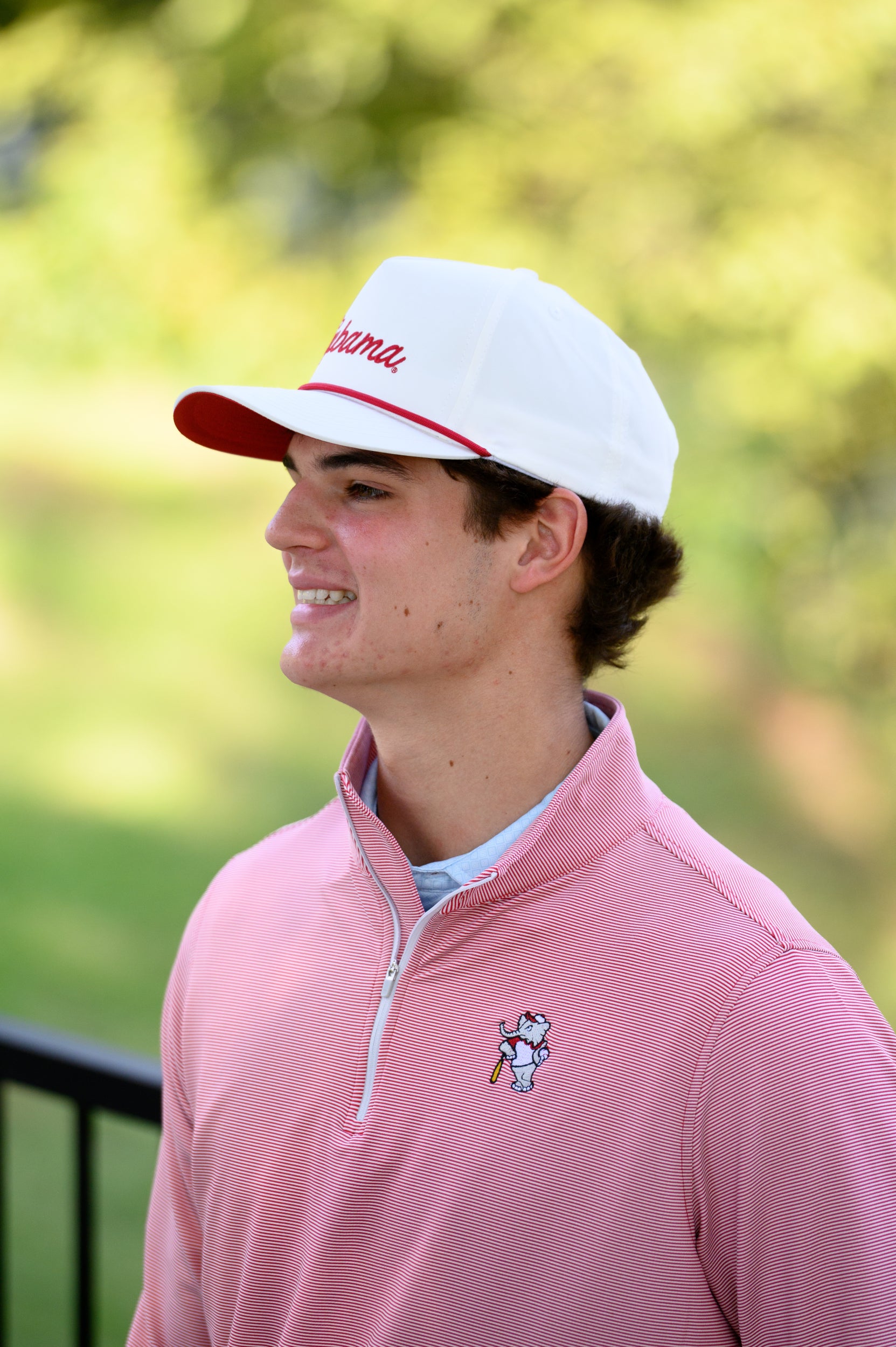 University of Alabama BallPlayer Al Men's Crimson Performance Pullover with an embroidered image of Big Al in a baseball uniform leaning on a baseball bat