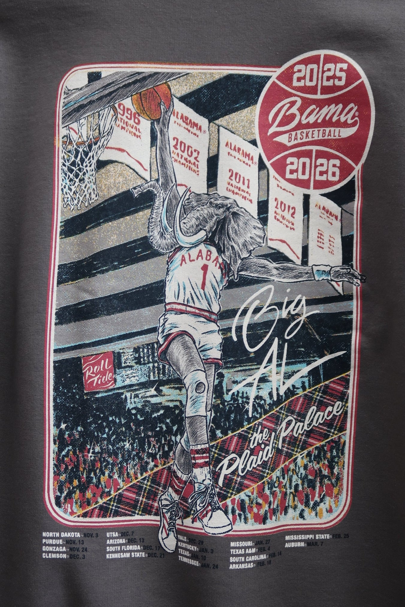 University of Alabama Dark Grey Sweatshirt with an illustration of Big Al dunking a basketball next to text “Big Al” and “the Plaid Palace” above the 2025 Basketball Schedule