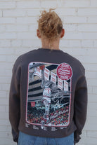 University of Alabama Dark Grey Sweatshirt with an illustration of Big Al dunking a basketball next to text “Big Al” and “the Plaid Palace” above the 2025 Basketball Schedule