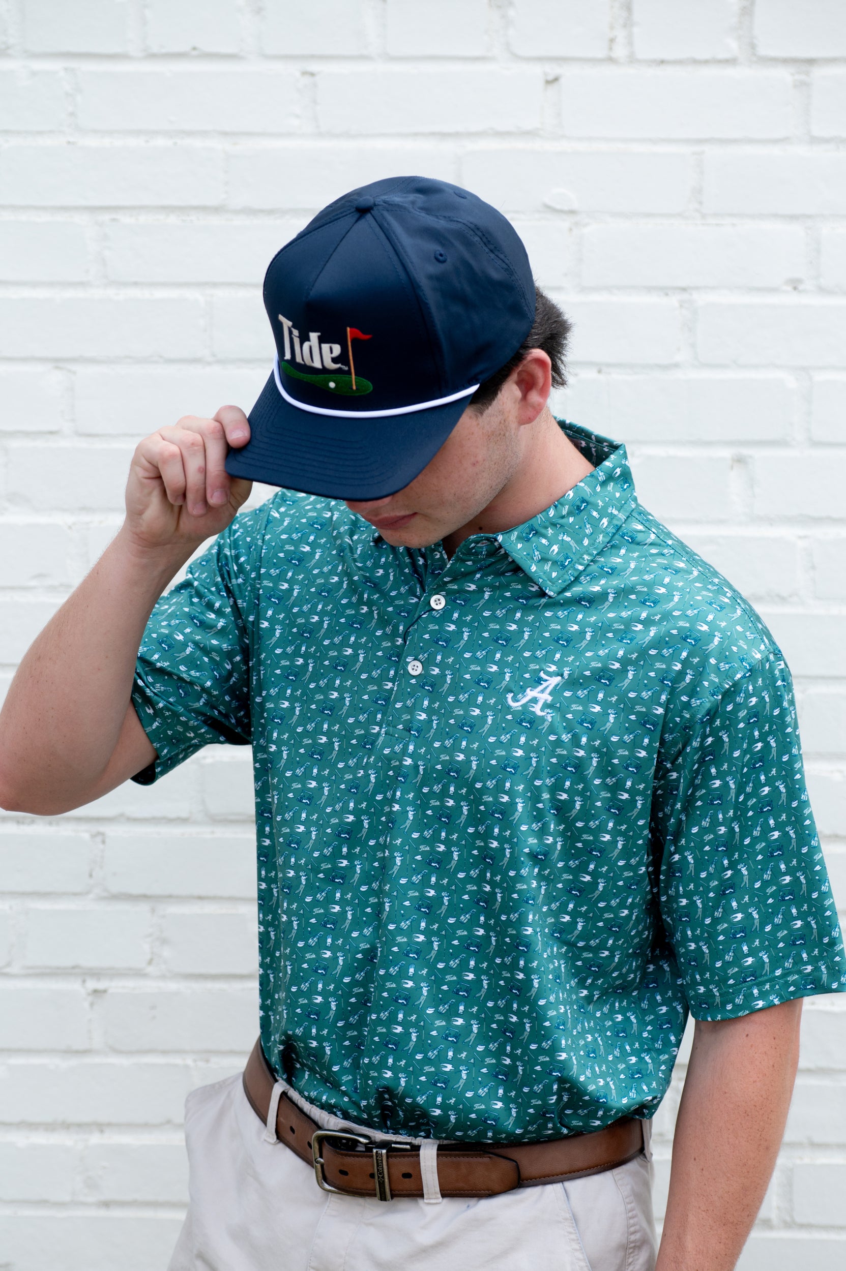 University of Alabama Green Men’s Polo with an Alabama golf-themed pattern and Silver Script A Logo embroidery