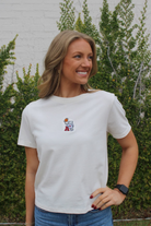 University of Alabama Off-White Ladies Short Sleeve T-Shirt with the Basketball Al Logo embroidered on the middle of the chest