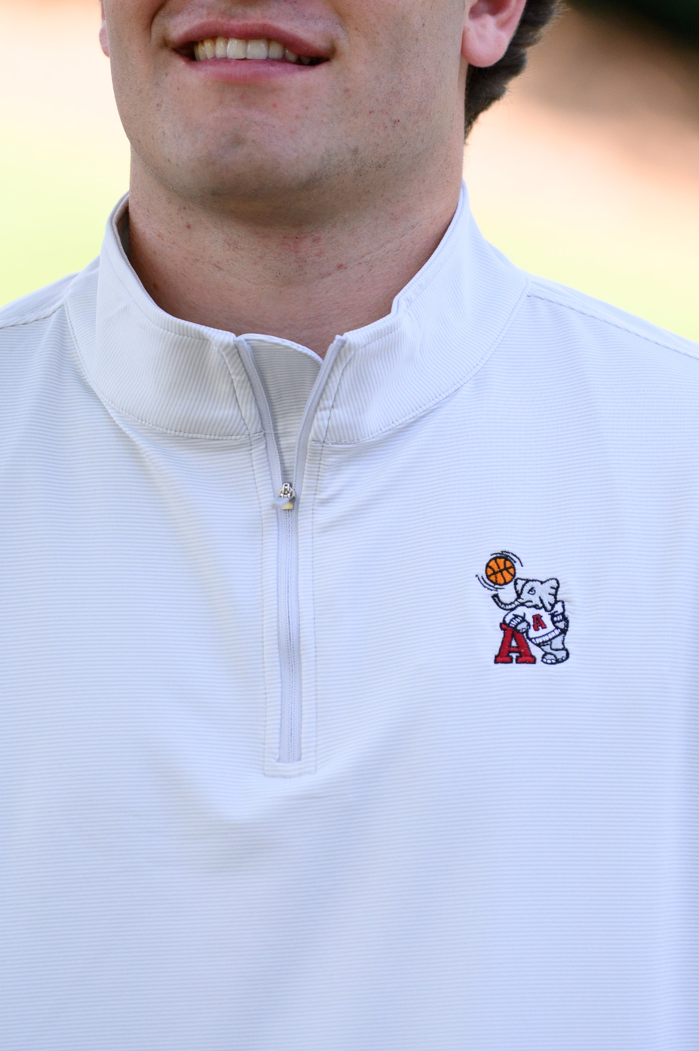 University of Alabama Basketball Al Men's Light Grey 1/4 Zip with an embroidered Big Al in a sweater holding a basketball and leaning against an "A"