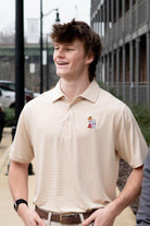University of Alabama Basketball Al Tan Men’s Polo with an embroidered Big Al in a sweater holding a basketball and leaning against an "A"