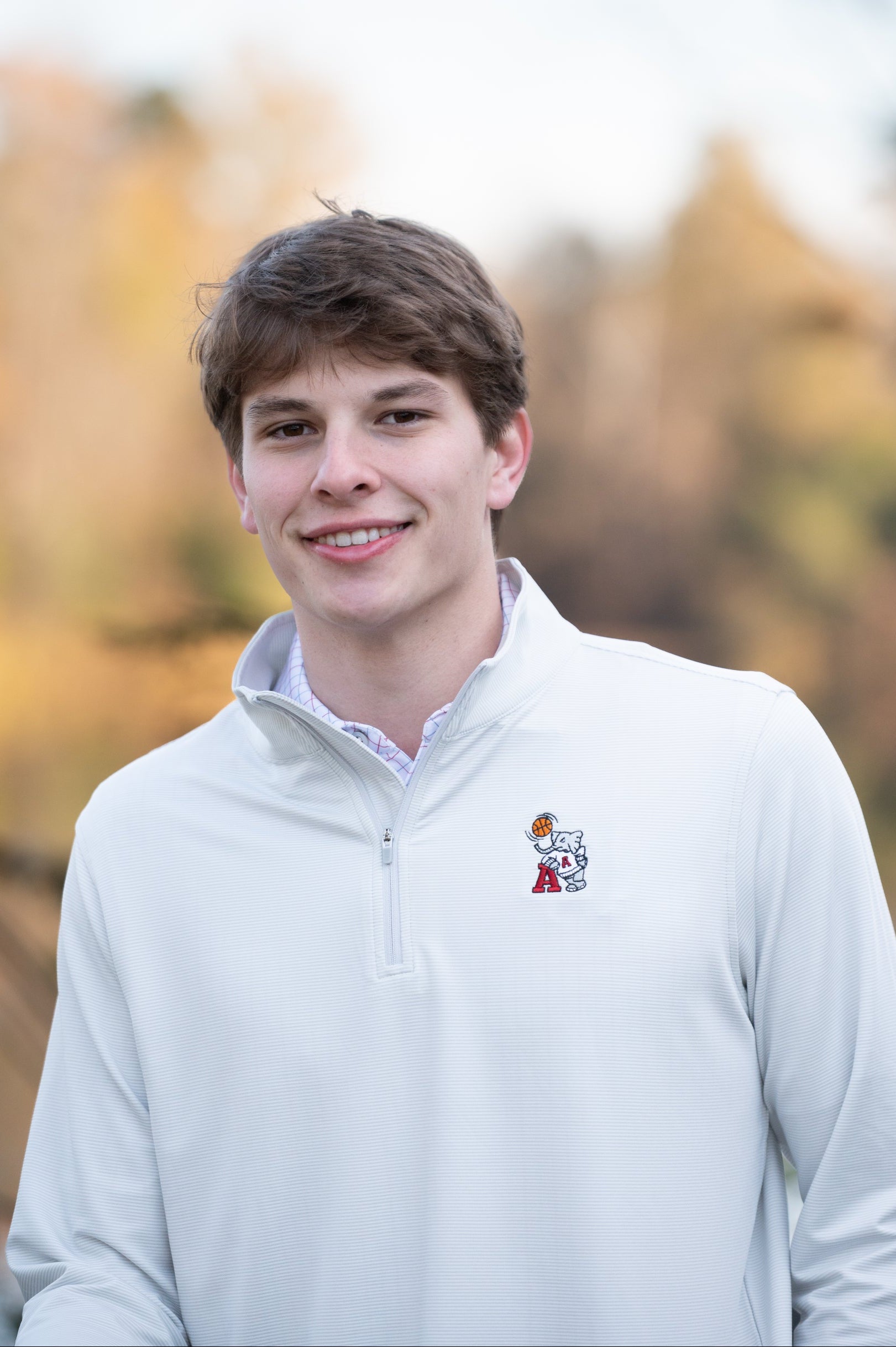 University of Alabama Basketball Al Men's Light Grey 1/4 Zip with an embroidered Big Al in a sweater holding a basketball and leaning against an "A"