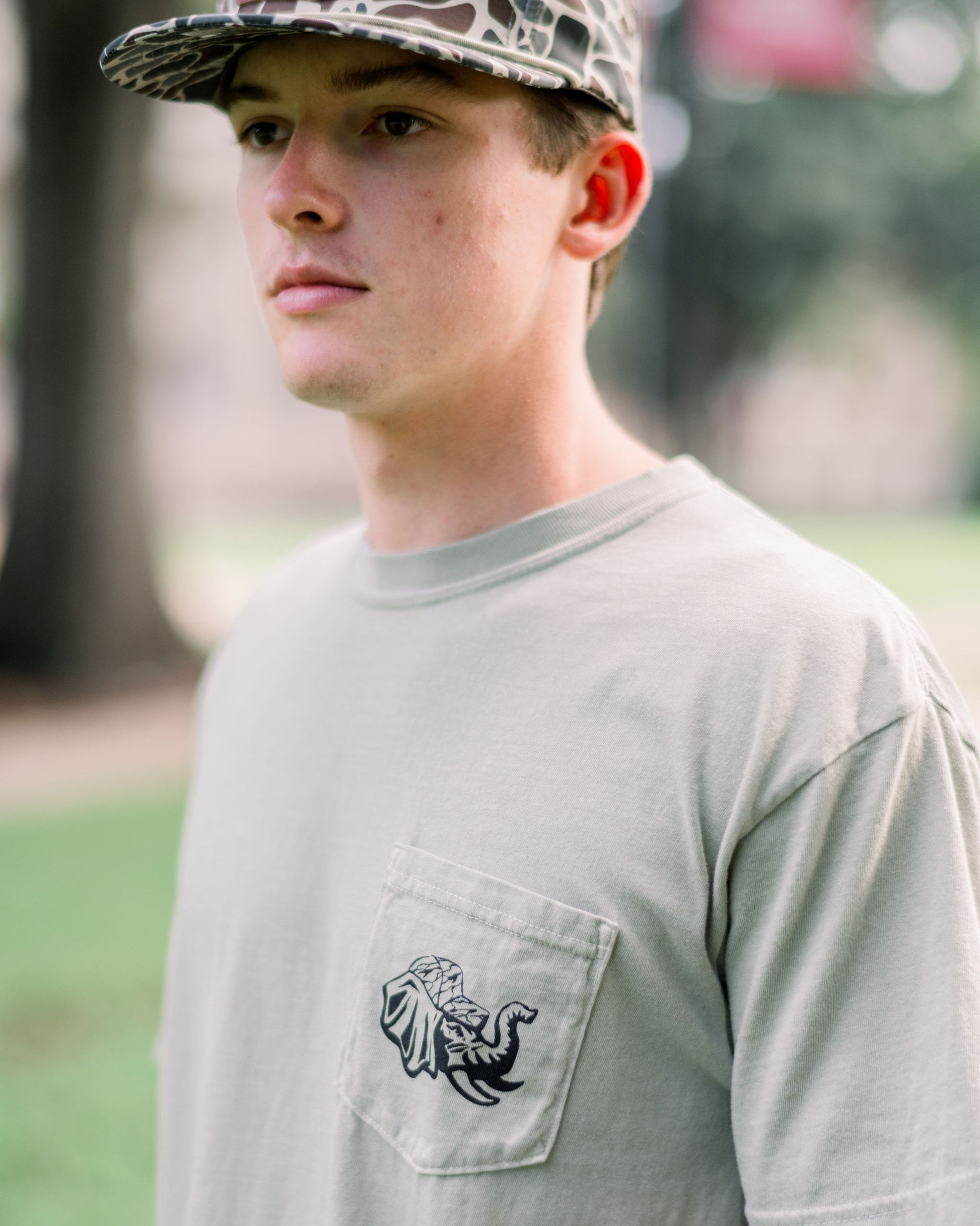 University of Alabama Sandstone Front Pocket with Big Al wearing a Camo Hat