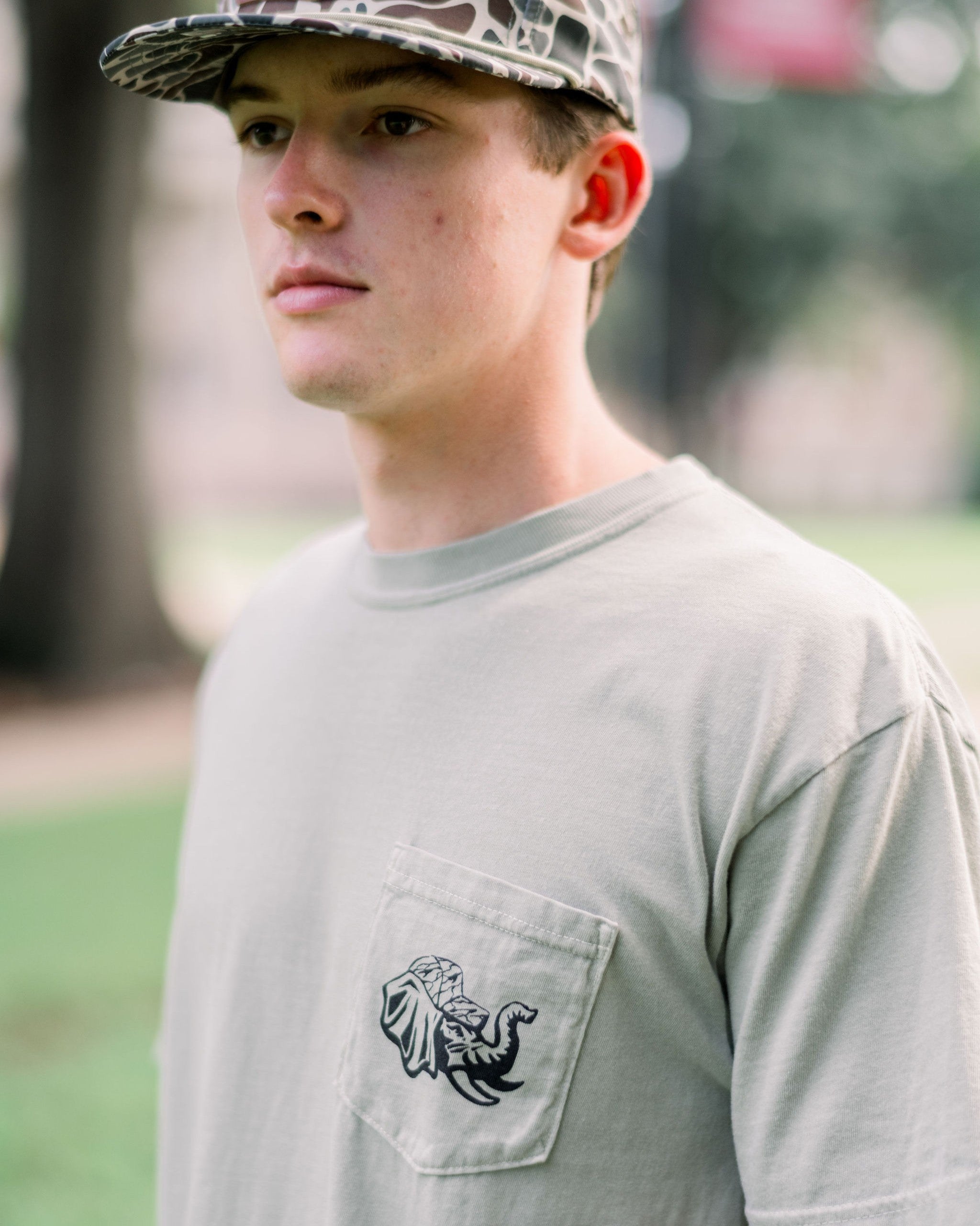 University of Alabama Sandstone Front Pocket with Big Al wearing a Camo Hat