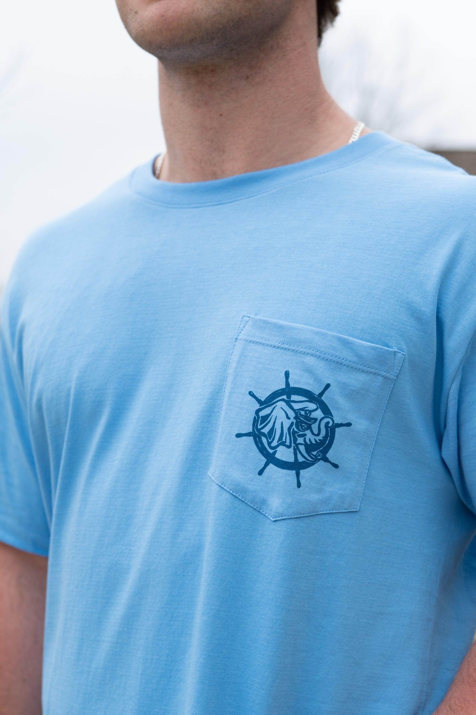 University of Alabama Blue Shirt with a front pocket featuring a ship’s wheel behind a Sailor Big Al design