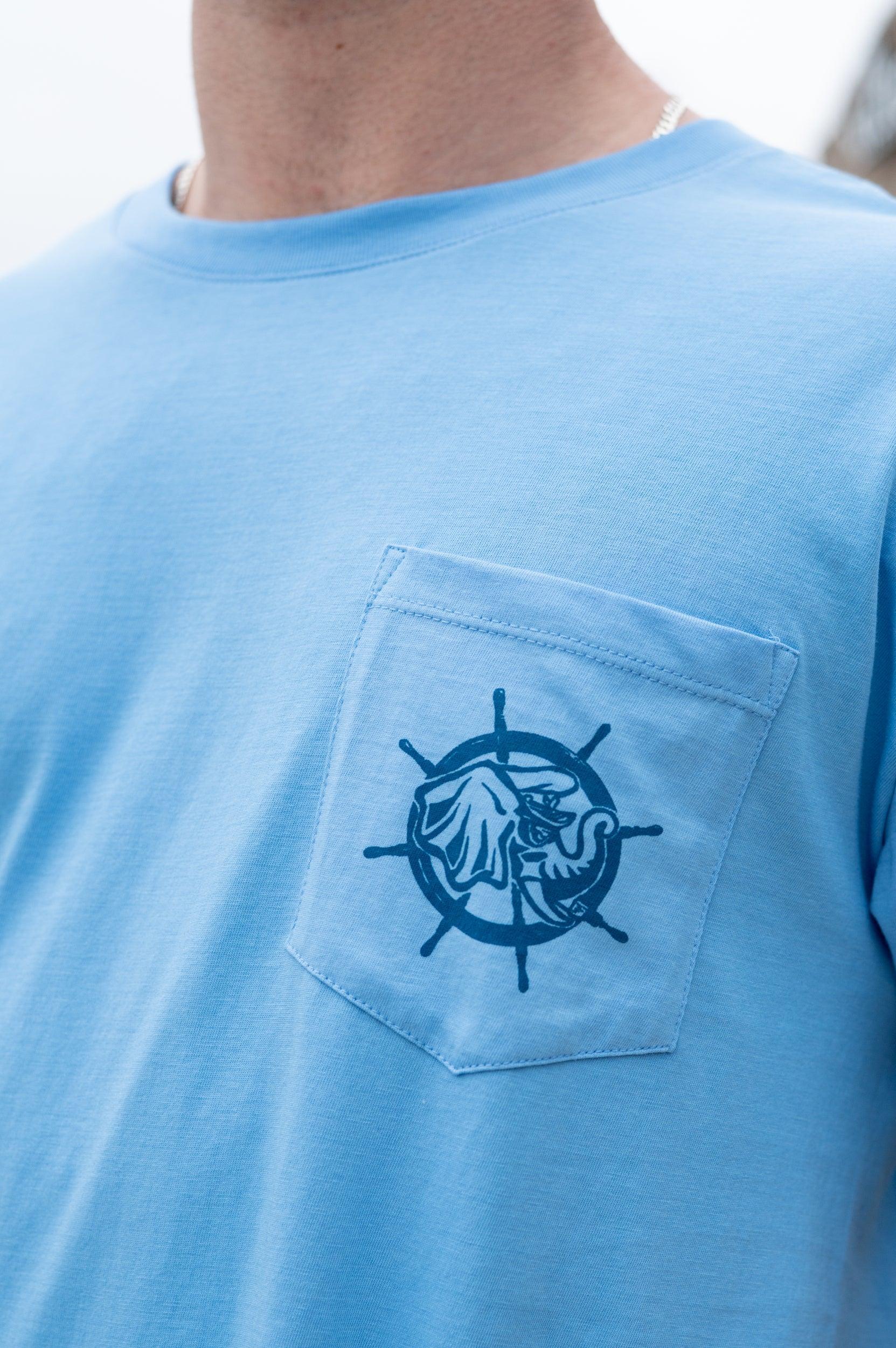University of Alabama Blue Shirt with a front pocket featuring a ship’s wheel behind a Sailor Big Al design
