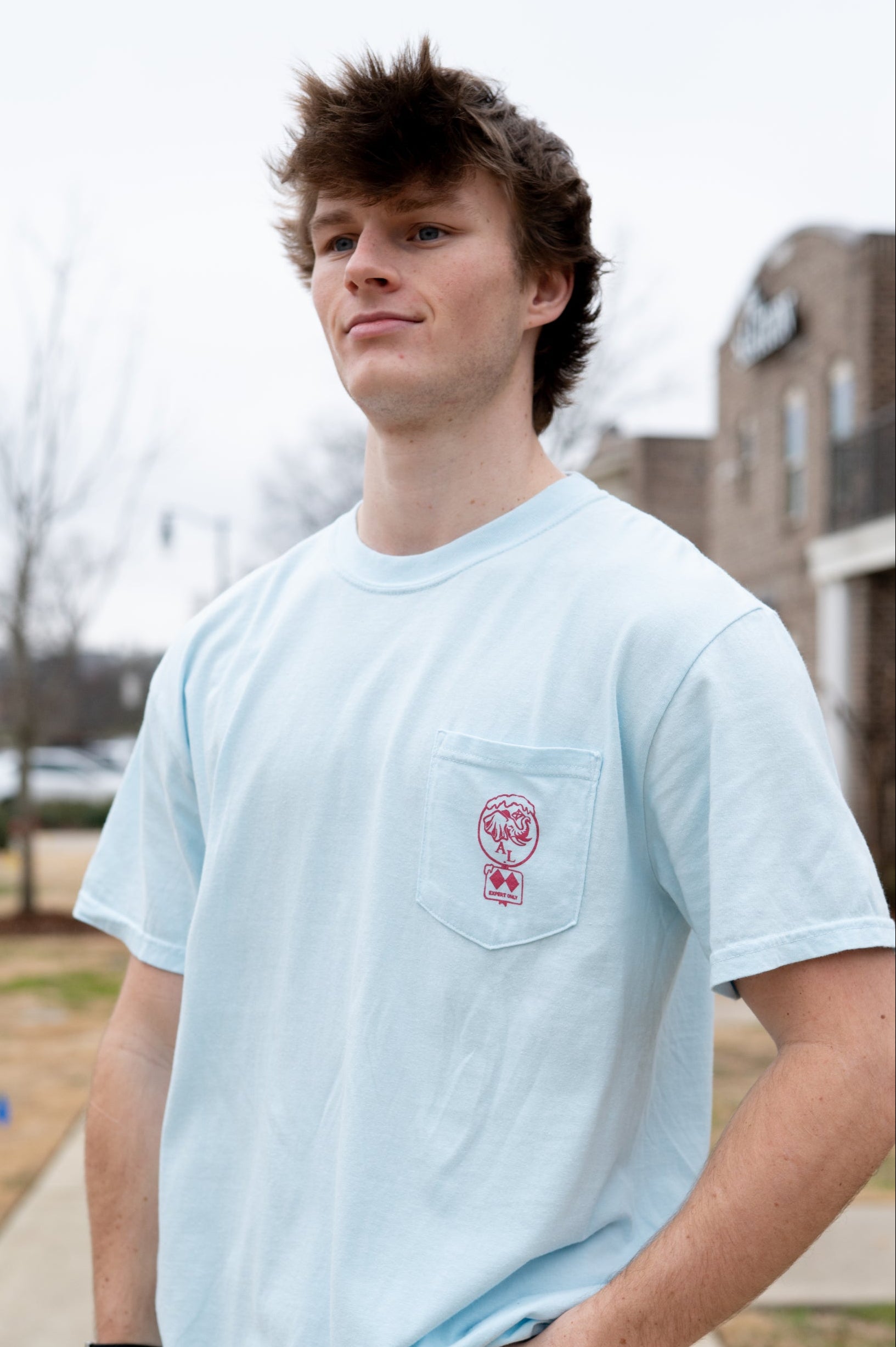 University of Alabama Light Blue T-Shirt with a snow-covered Elephant Seal on the front pocket 