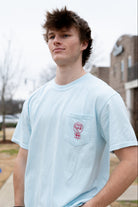 University of Alabama Light Blue T-Shirt with a snow-covered Elephant Seal on the front pocket 