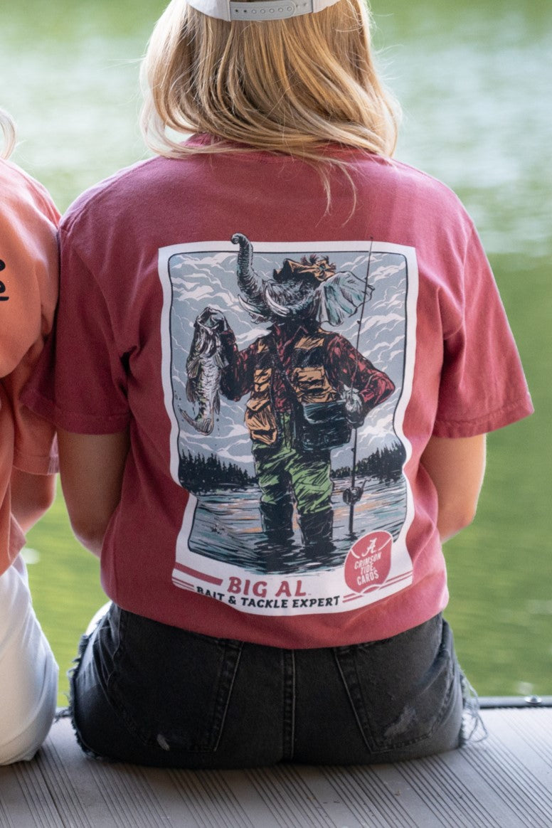 University of Alabama Big Al Fishing Comfort Colors Red T-Shirt with image of Big Al standing in the water holding a fishing pole