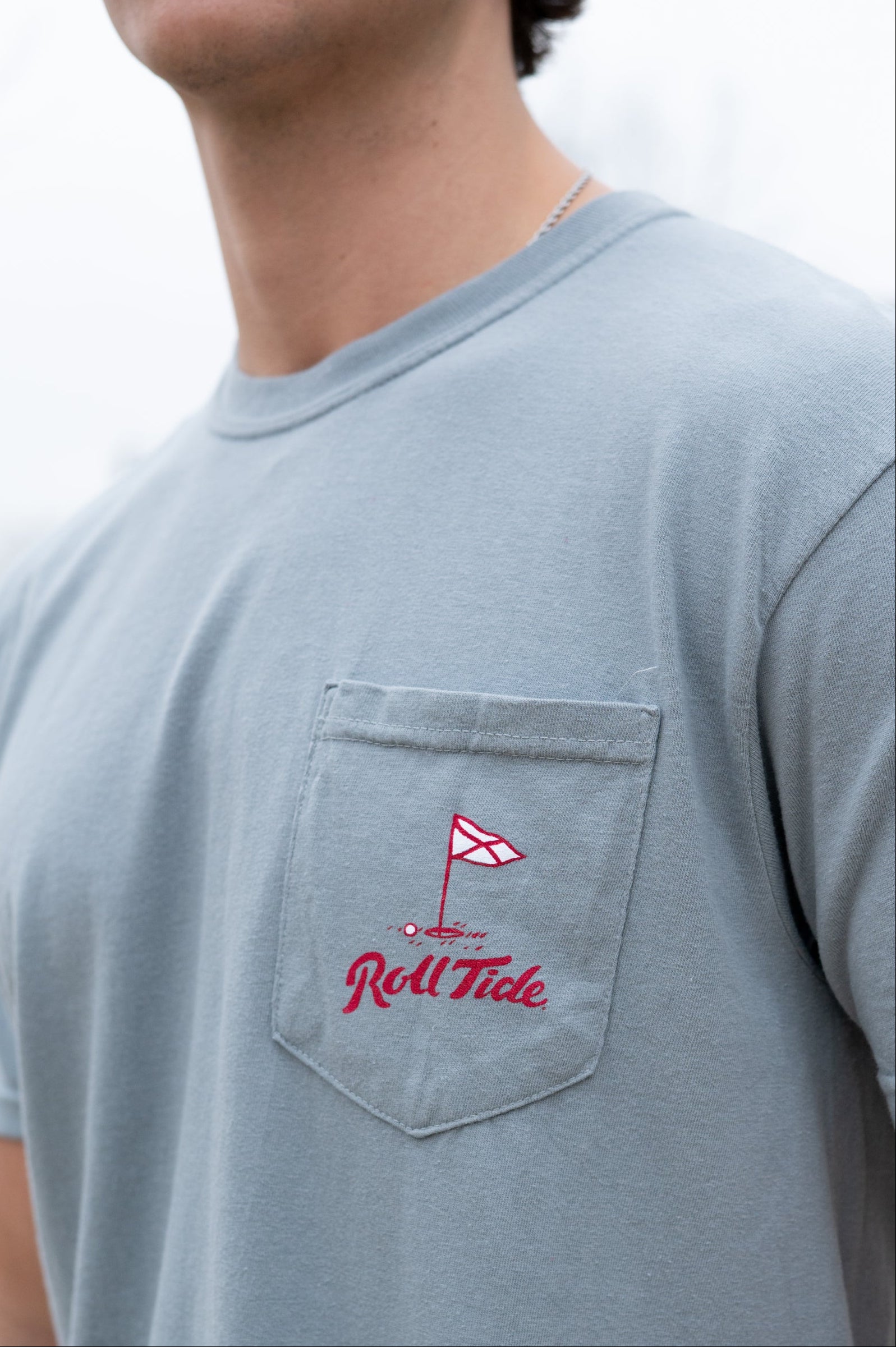 University of Alabama Grey Shirt with a Golf Flag over “Roll Tide” Script on the Front Pocket
