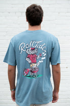 University of Alabama Blue T-Shirt with a drawing of Big Al grilling and the words “Roll Tide” written in the smoke
