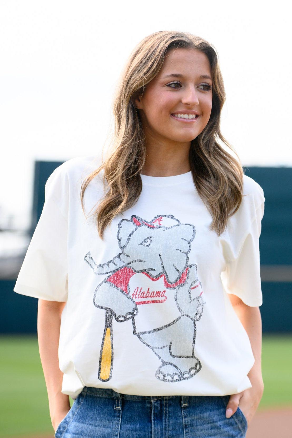 University of Alabama Big Al Vintage Baseball Ivory SoftShirts T-Shirt with an image of a vintage Big Al in a baseball uniform leaning against a baseball bat  