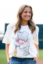University of Alabama Big Al Vintage Baseball Ivory SoftShirts T-Shirt with an image of a vintage Big Al in a baseball uniform leaning against a baseball bat  