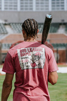 University of Alabama Red Comfort Colors T-Shirt with an image of Big Al in baseball gear swinging a bat below text "Big League Bama"