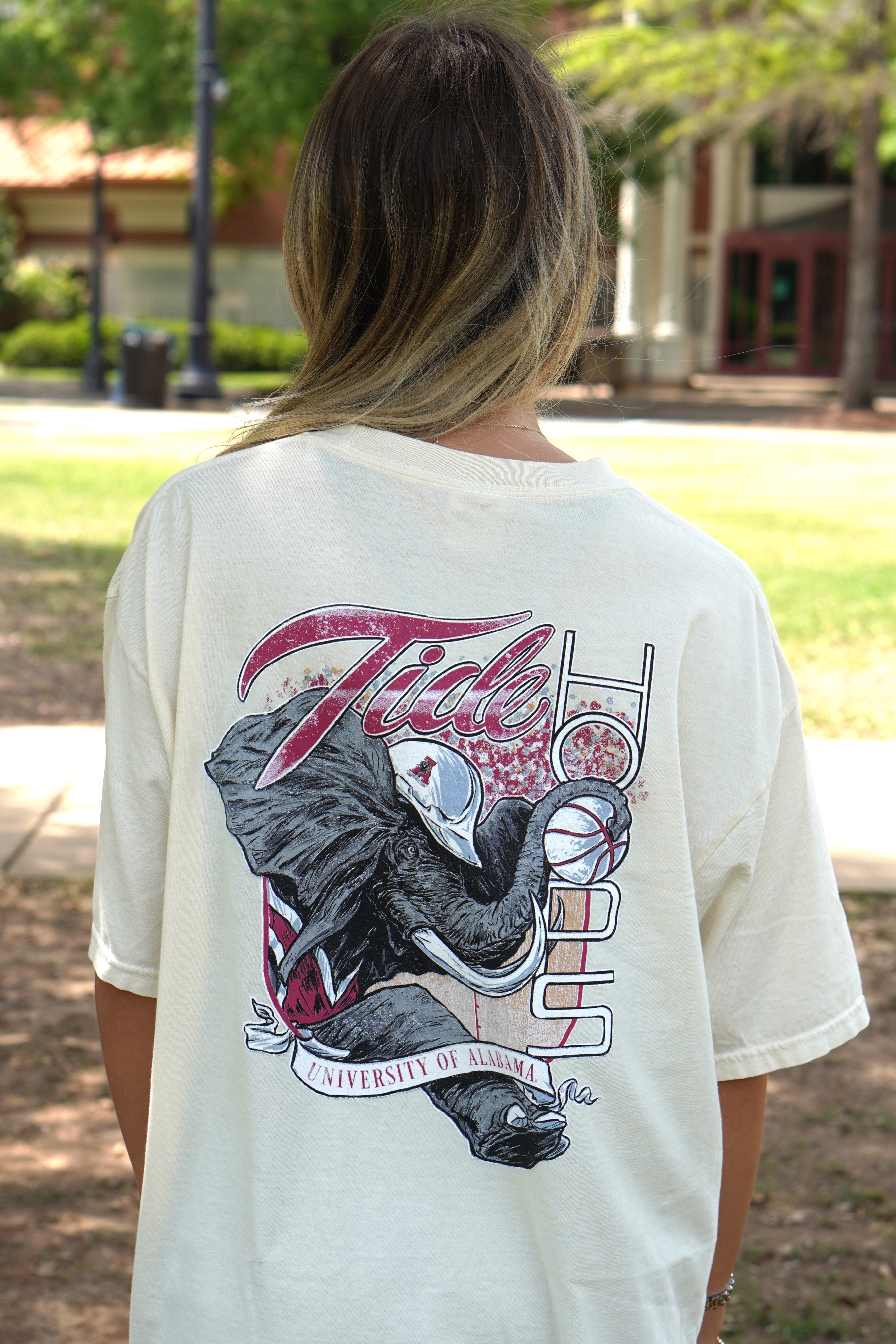 University of Alabama Cream Comfort Colors T-Shirt with an image of Big Al in a hard hat holding a basketball to form the second "O" in "HOOPS 