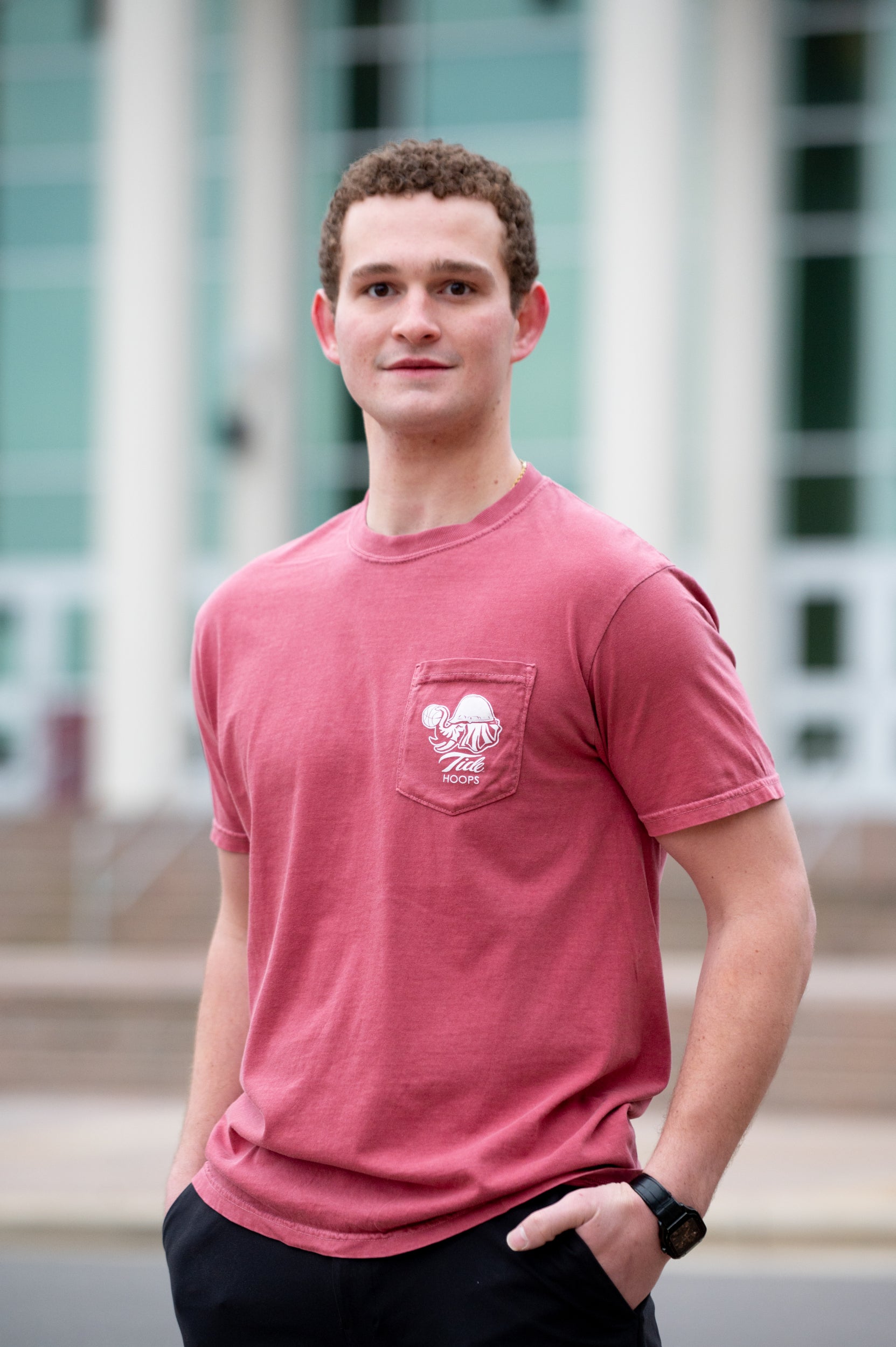 University of Alabama Red T-Shirt with Big Al wearing a hard hat and holding a basketball with his trunk to help spell the word “Hoops”
