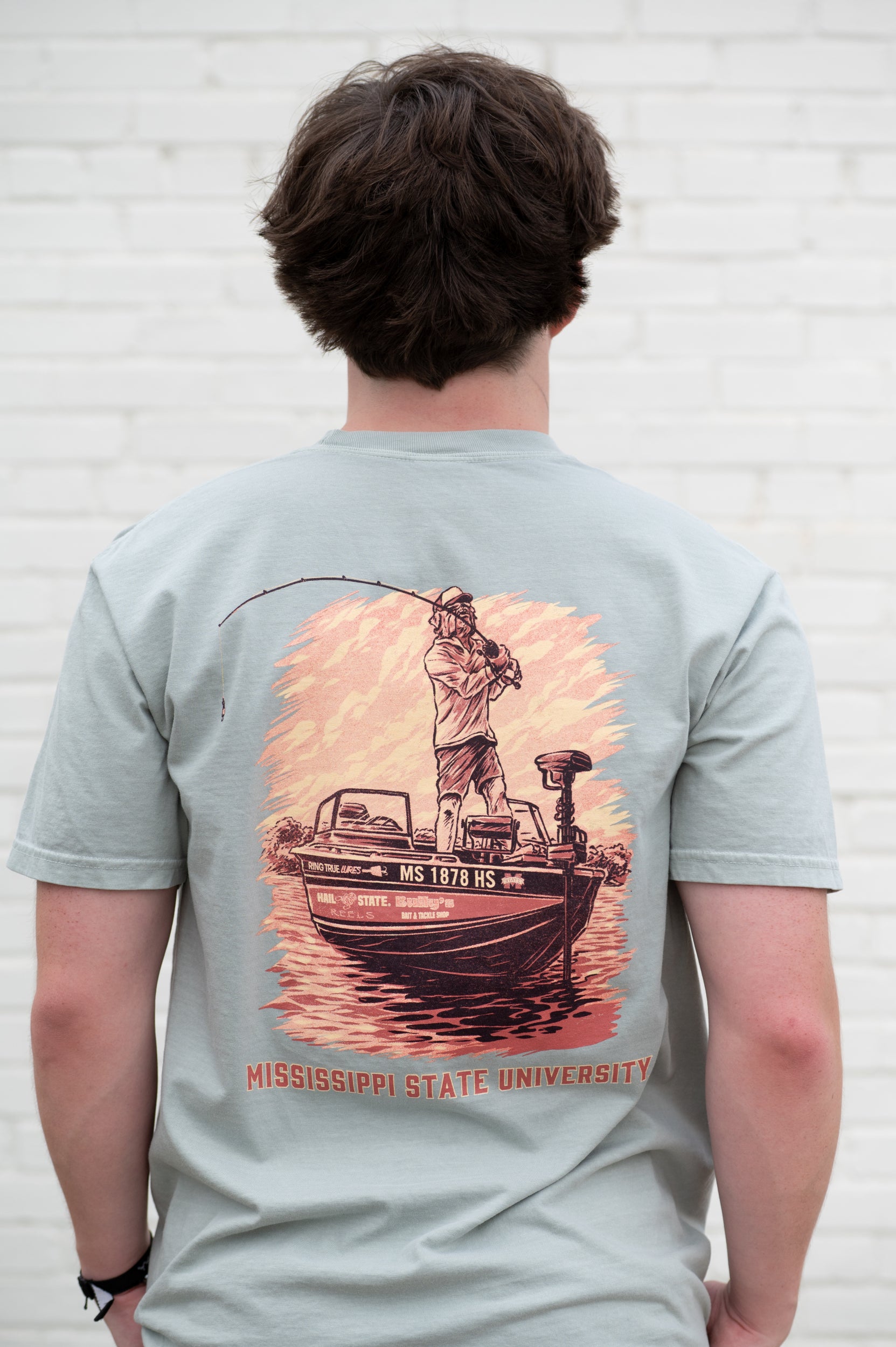 Mississippi State Light Green T-Shirt with an image of Bully bass fishing in a boat