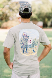 Mississippi State Beige T-Shirt with an illustration of Bully in hunting gear filling an M State deer feeder with a deer in the background