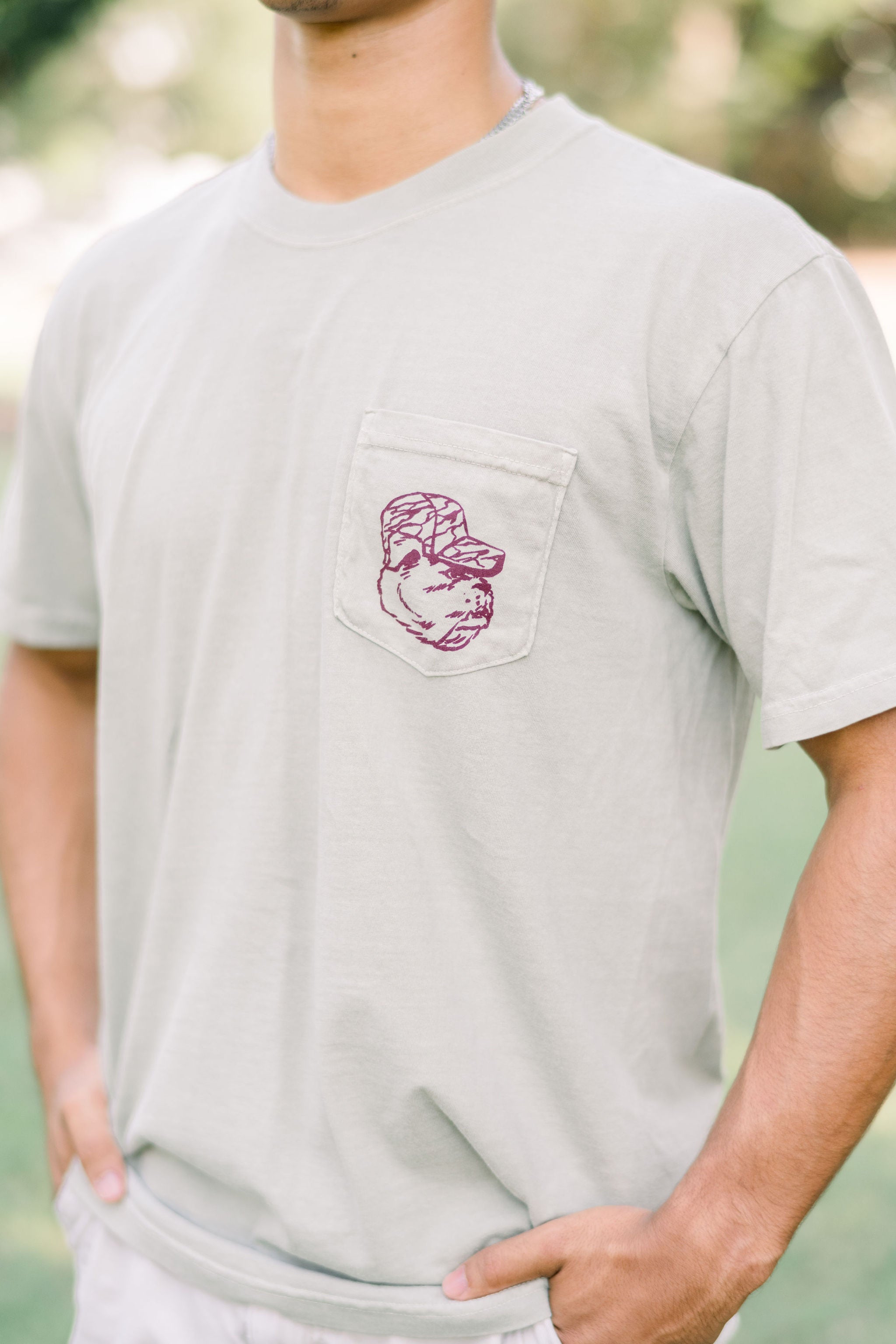 Mississippi State Beige Front Pocket with a Maroon print of Bully wearing a Camo Hat