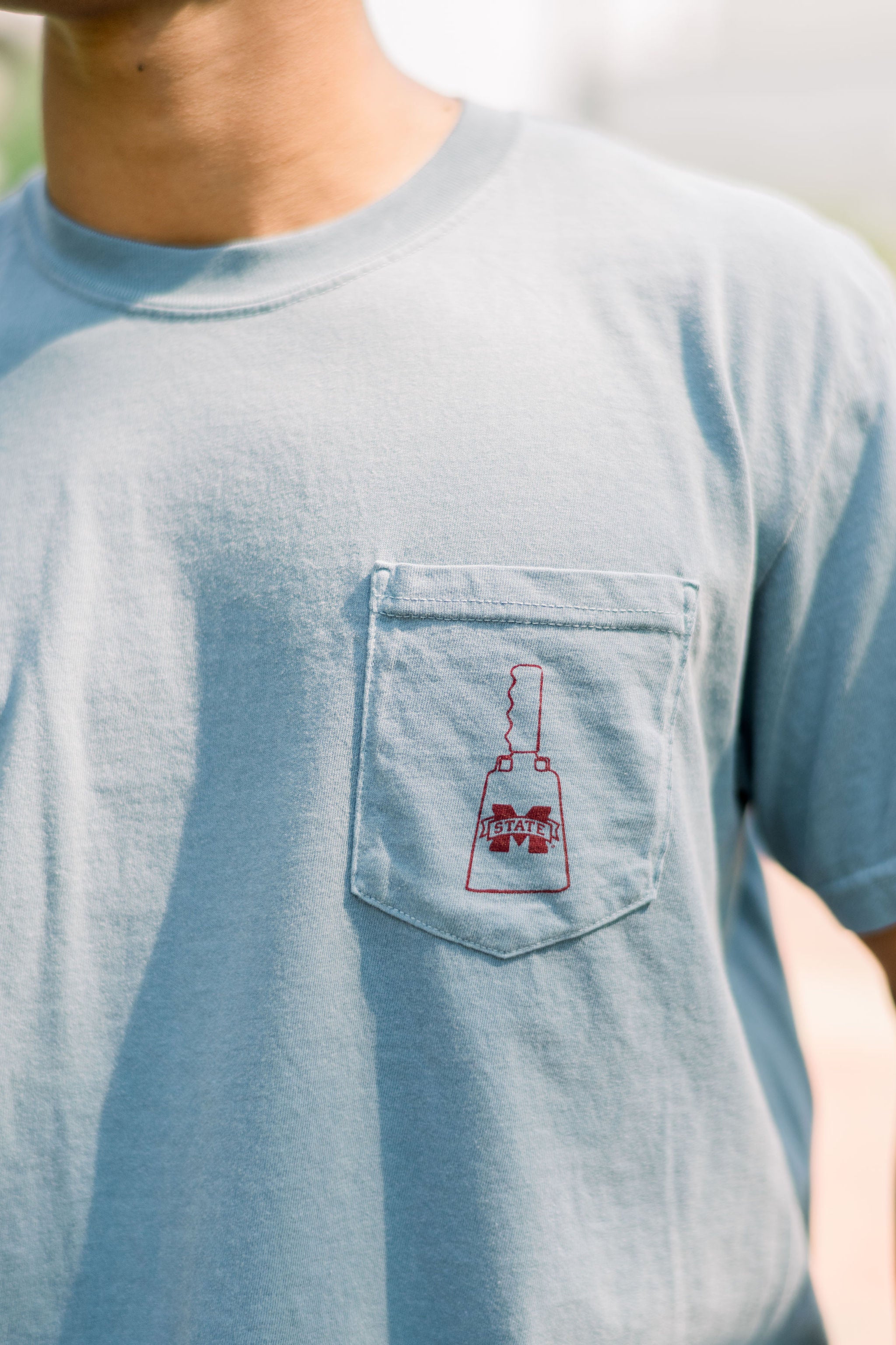 Mississippi State Dusty Blue Front Pocket with a Maroon print of a MS State Cowbell
