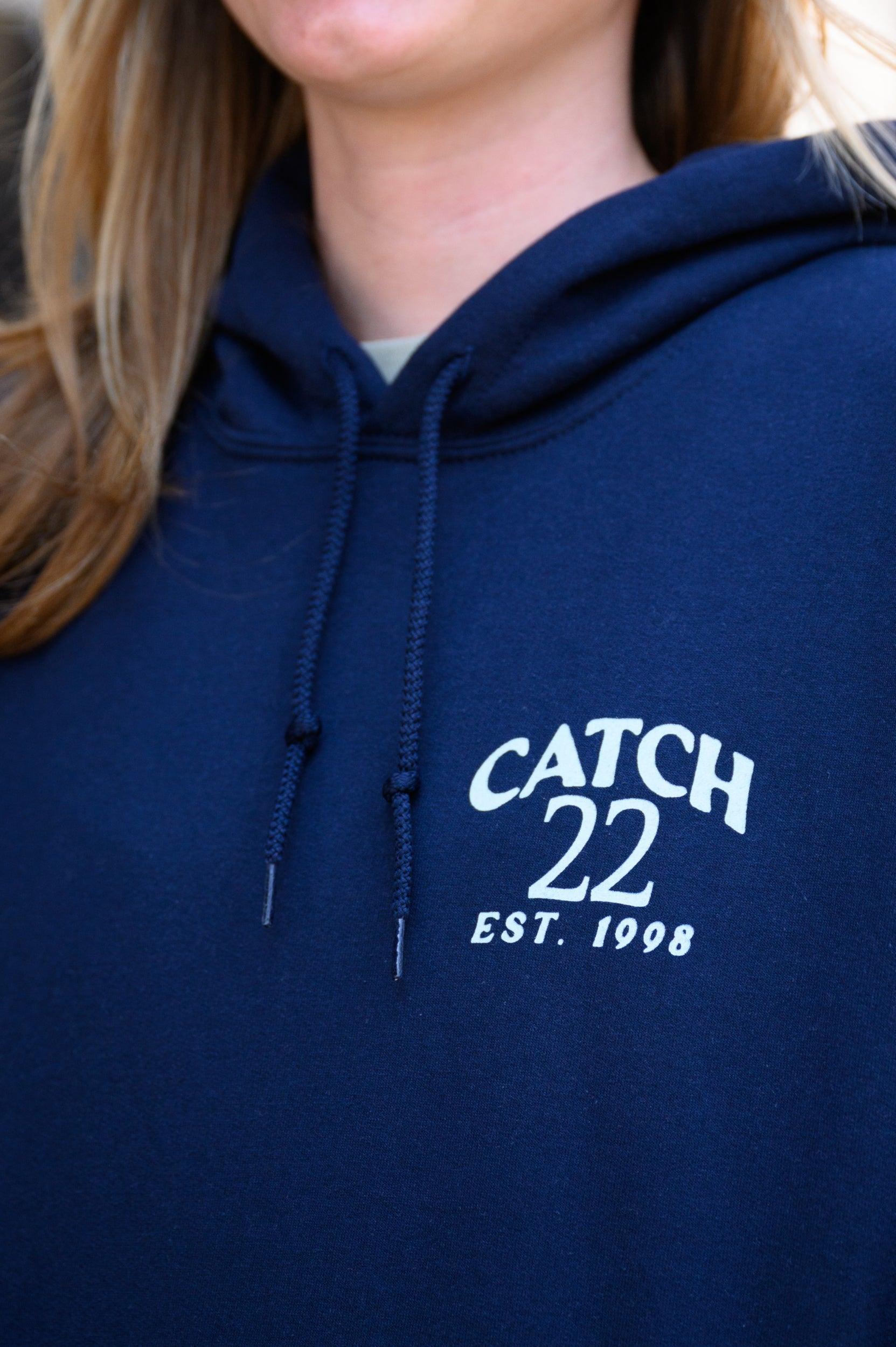 Left chest design with Seafoam Green text “Catch 22- EST. 1998”