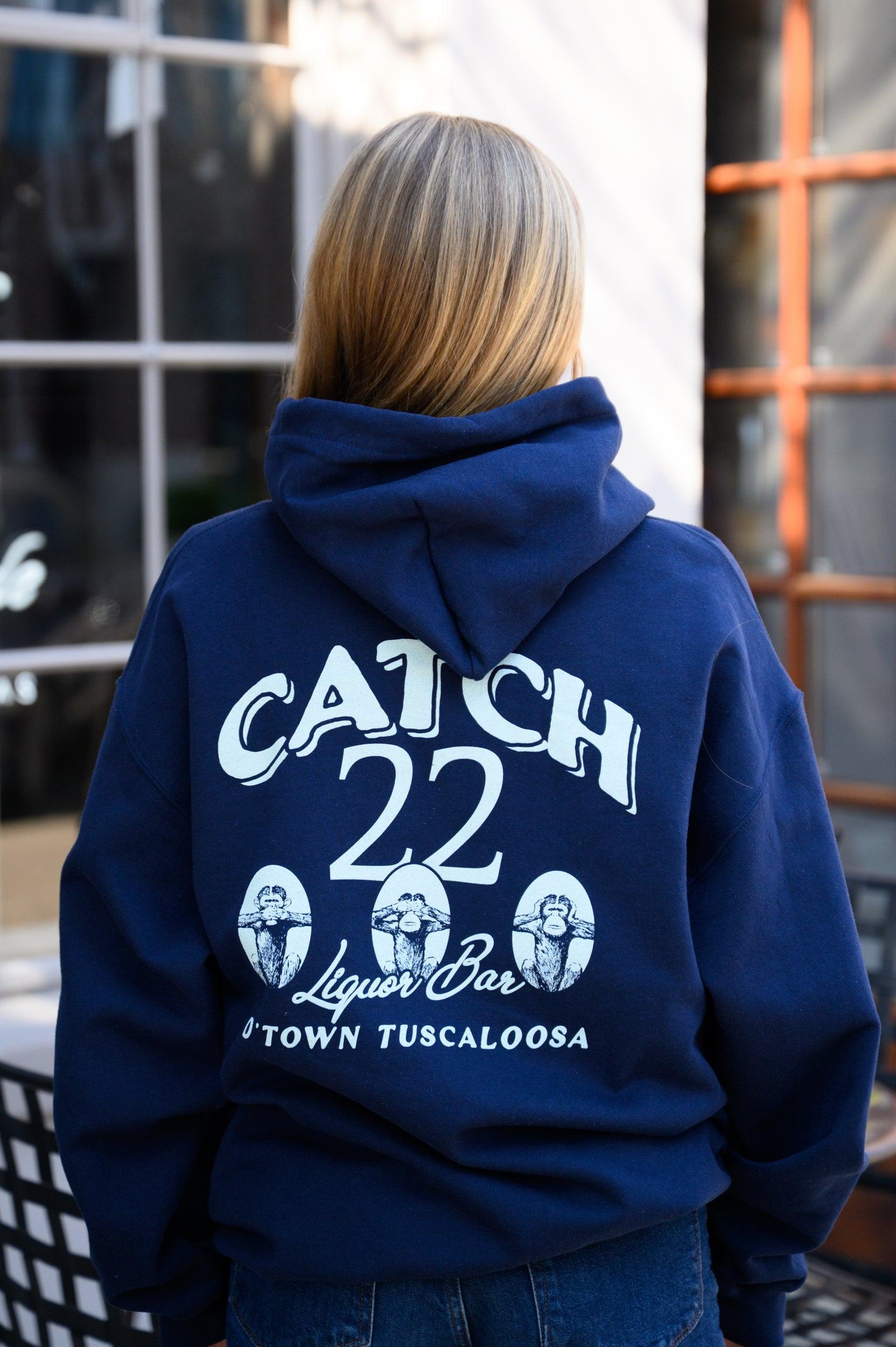 Catch 22 Navy Hoodie with Seafoam Green text “Catch 22 Liquor Bar D’ Town Tuscaloosa” and three monkeys playing peekaboo